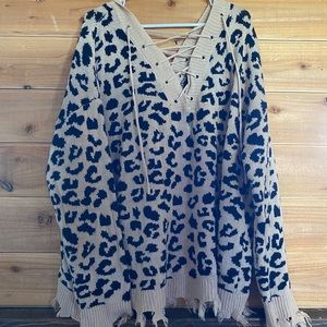 Cheetah printed sweater. Laced front and back.